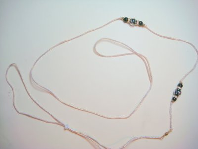 Lead 15-Gold cord with black beads