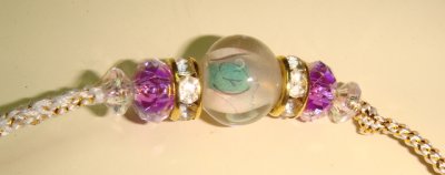 Glass, purple beads and rondells detail