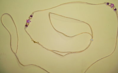Lead 23 -Gold and White cord with purple star beads