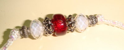 Lead 1 detail Red, Silver, and white beads