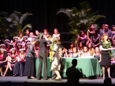 Family gives the lei with the pin