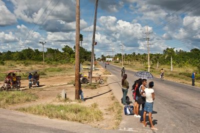 Typical Scene of People Waiting to Hitch a Ride