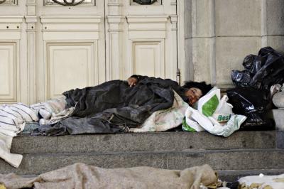 Destitute on the steps of Teatro Colon ........