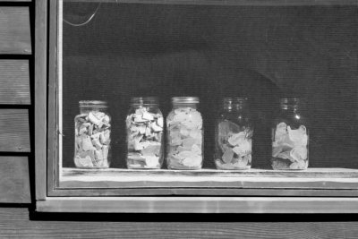 Jars of Sea Glass and Pottery Shards on Window Sill