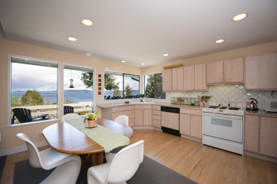 Kitchen, dining area and view of Puget Sound