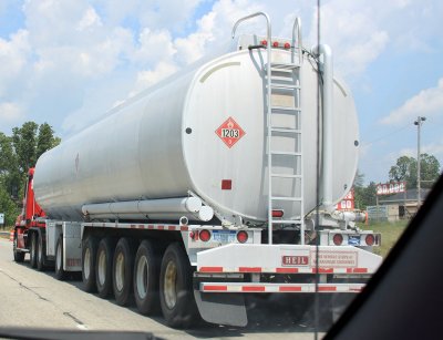 Standard sized tanker, 9 axles, 34 tires, see sign..crappo road.  