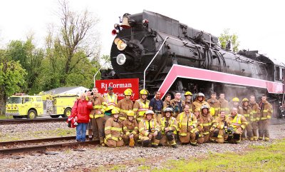 Members of the Bagdad fire Dept. pose for a group shot after helping to service the locomotive 