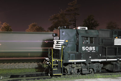 A Eastbound grain train streaks by NS 5085