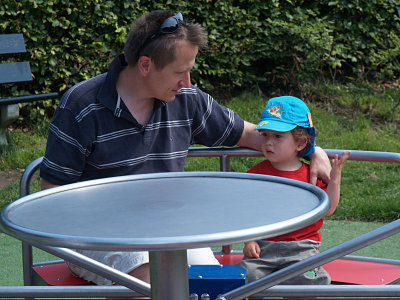 Yannick talks with Daddy on the roundabout