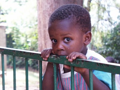 Boy eating railing Sanyu Babies Home Kampala Uganda