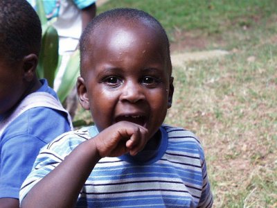 Boy with fingers in mouth Sanyu Babies Home Kampala Uganda