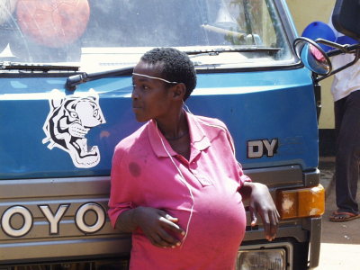 Kid in front of truck Kampala Uganda