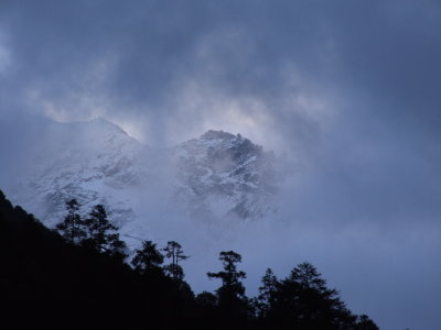 Himalayas through the clouds Lukla Nepal.JPG