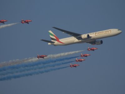 Emirates 777 and Red Arrows fly by Dubai Air Show 2007.JPG
