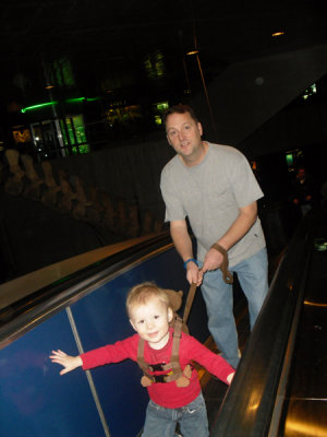 Liam pulling daddy up the escalator
