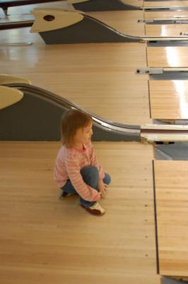 Because then she could just sit and watch the ball as it sloooooowly approached the pins