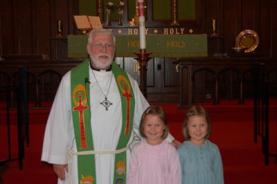 Baptism Day - Pastor Gene with Rory (pink) and Reagan (green)