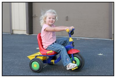 Emily on her tricycle
