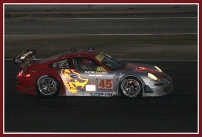 Flying Lizard Motorsports Team at night with glowing rotors