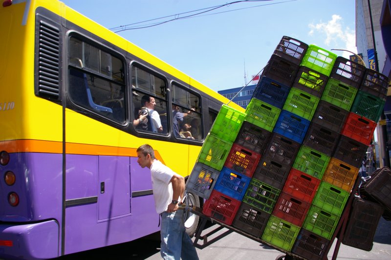 Colorful Plastic Milk Crates and Bus