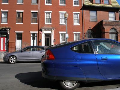 Blue Honda Insight & Row Houses