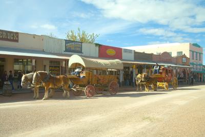 A Covered Wagon And Stage Coach