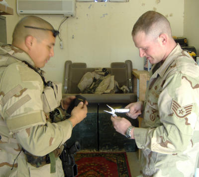 SSgt. Pablo Matinez & SSgt Andrew Nichols checking out the gifts.