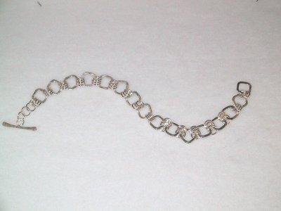Heavy(approx 25 grams)sterling bracelet.  It's 22 cm long, but can be worn any length. SOLD
