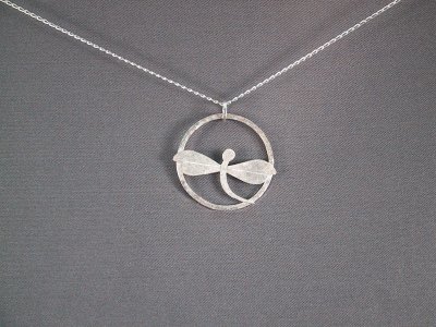 This dragonfly pendant is about 30mm in diameter.