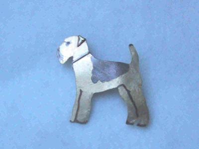 this airedale was custom made for a friend.  brass with a sterling collar. approx 5 x 5 cm