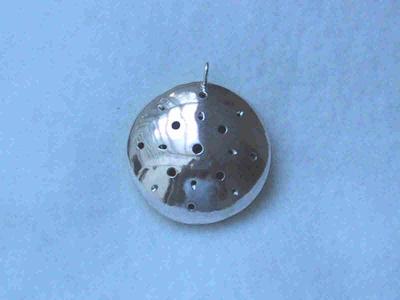 silver side of the lentil pendant. Sold