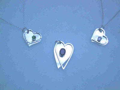 There are 3 different styles of 'floating hearts' (only 2 are pictured here).  They can be personalized with birthstones and/or names.