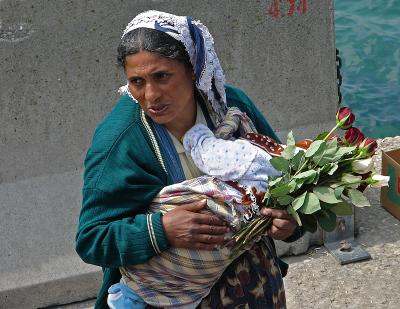 The rose seller with her baby