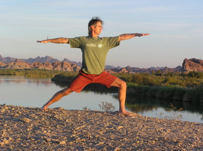 Practicing yoga while on a Colorado River Canoe trip