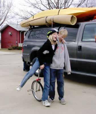 This is what brothers are for (helping with mom's unicycle)