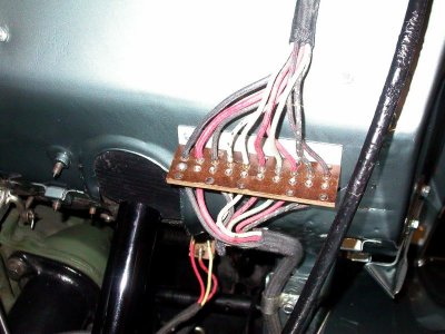 Junction block on firewall for chassis cables
