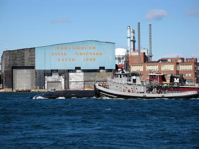 A Submarine sailing into Portsmouth Naval Shipyard