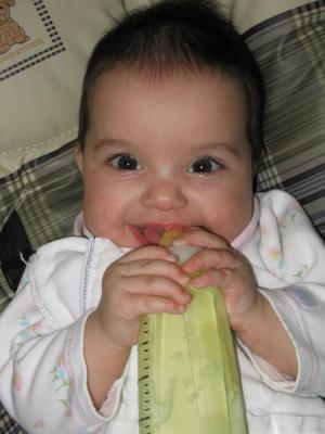 Evie in control of her bottle