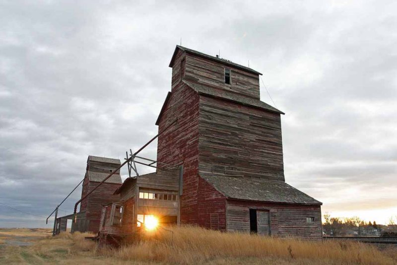  Old Wooden Grain Silo At Sunrise