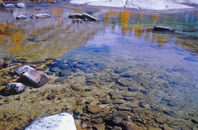 Lake in the Enchantments Reflects Glow of Fall Larch Trees