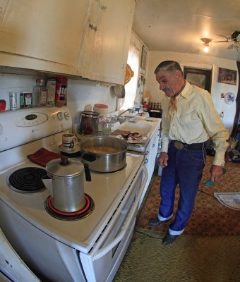 Katter Fixes Us Coffee , While His Dinner Also Cooks In HIs Kitchen