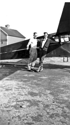 Dad (right) and friend by plane early 1920s Conn.