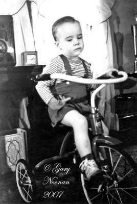 Gary on tricycle after scolding for riding away before pic could be taken.