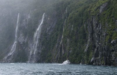 Waterfalls and boat, Milford Sound