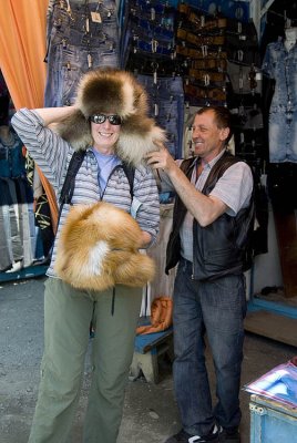 Trying on a shapka or fur hat
