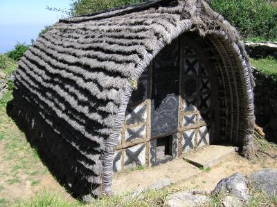 A local indigenous tribal temple -- the Toda tribe who were strict vegetarian and worshiped the buffalo -- note the carving.