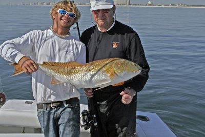 Tyler holding Kens big Redfish.jpg
