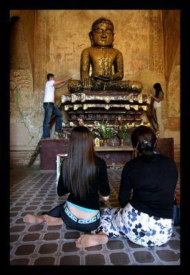 Applying Gold Leaf to Buddha