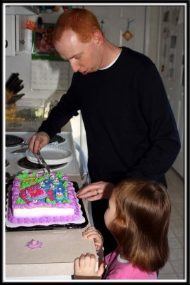 Daddy cuts the cake