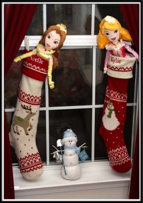 Santa leaves presents in the girls' stockings!